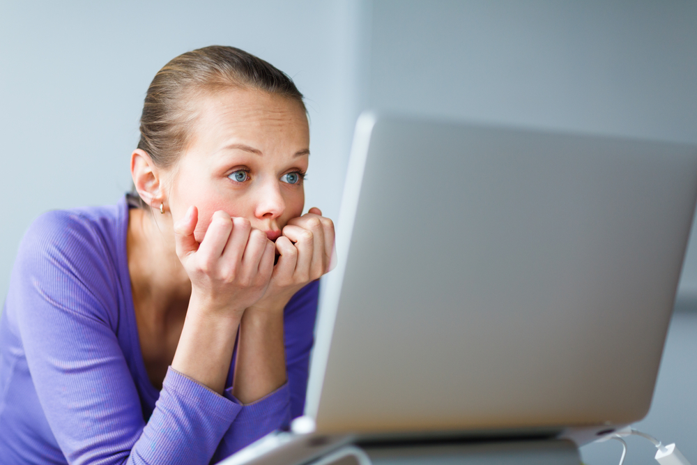 Woman With Tired Eyes using Computer